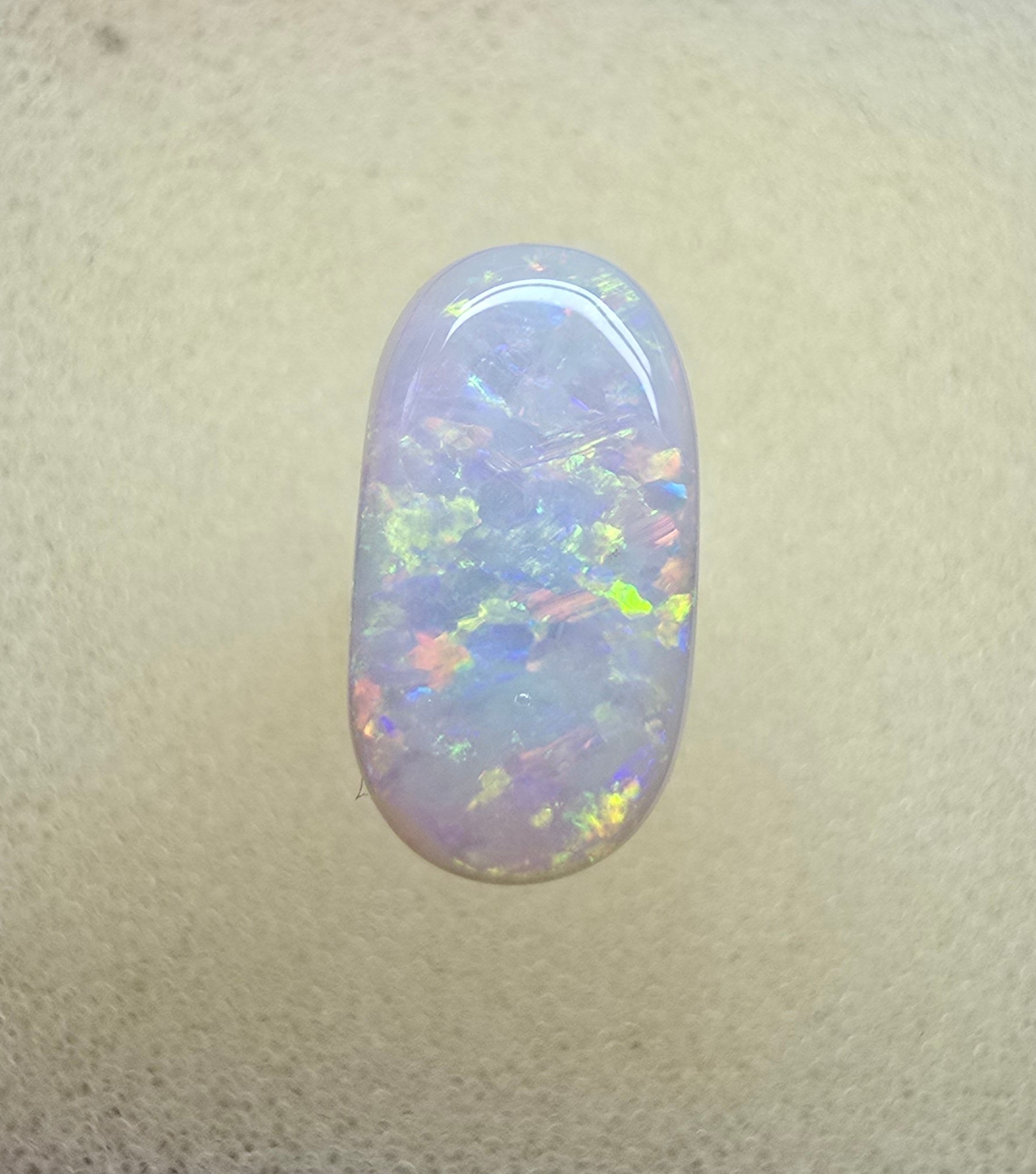 A911 - Oval cut bright red fire white opal
