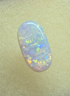 A911 - Oval cut bright red fire white opal