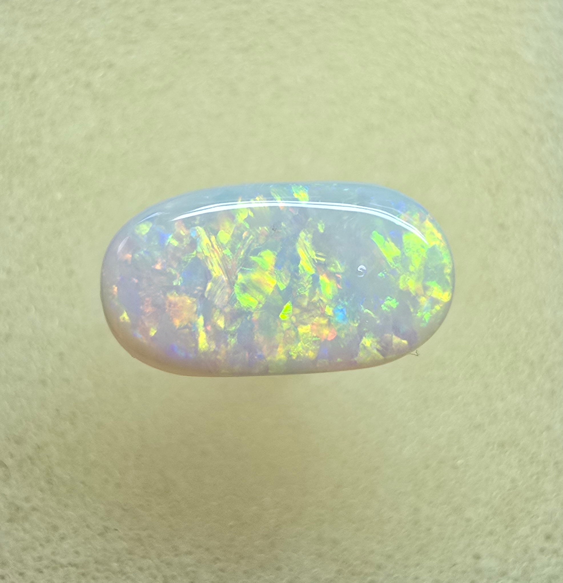 A911 - Oval cut bright red fire white opal