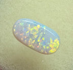 A911 - Oval cut bright red fire white opal