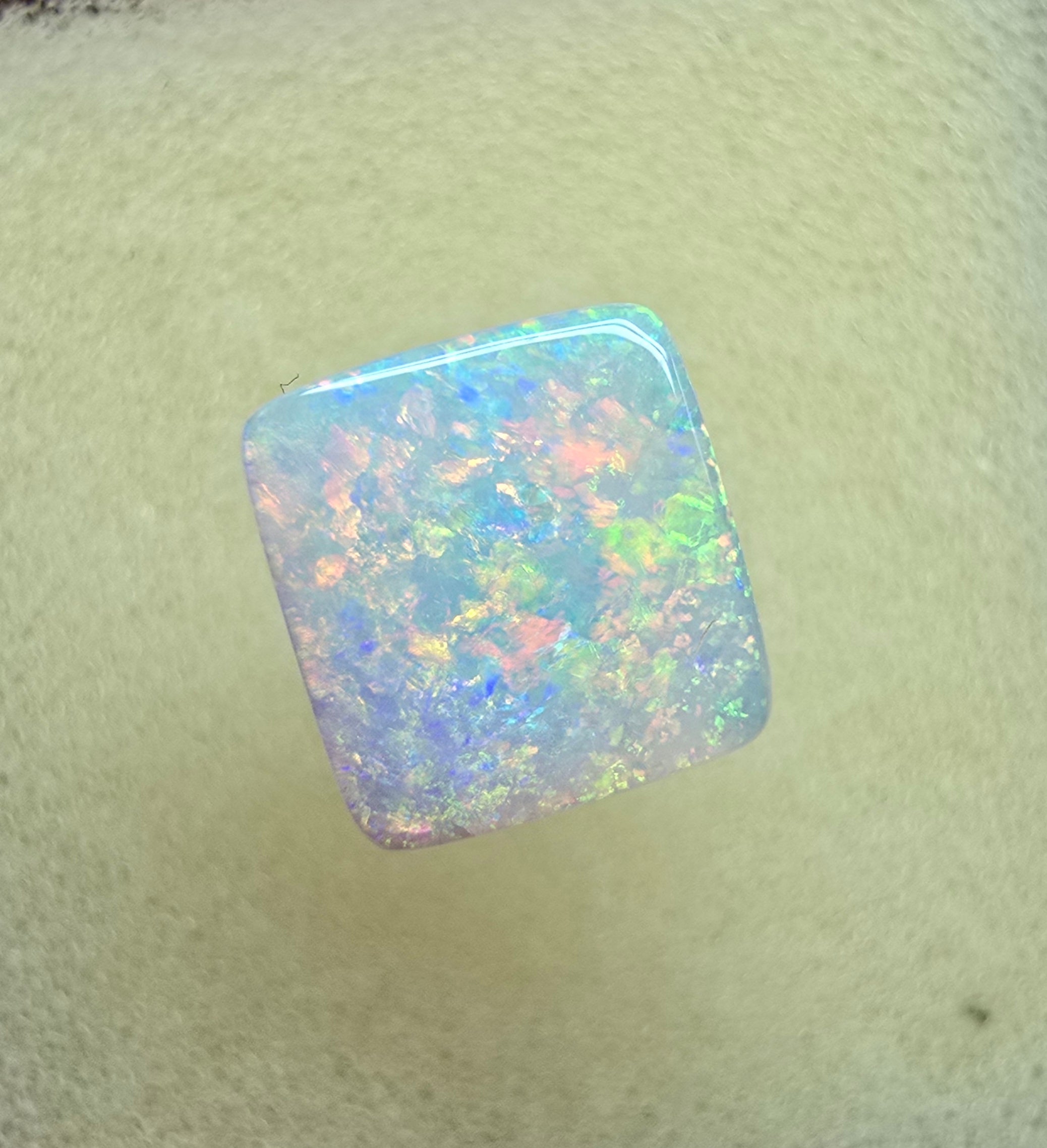 A912 - Brilliant cushion cut gem white opal