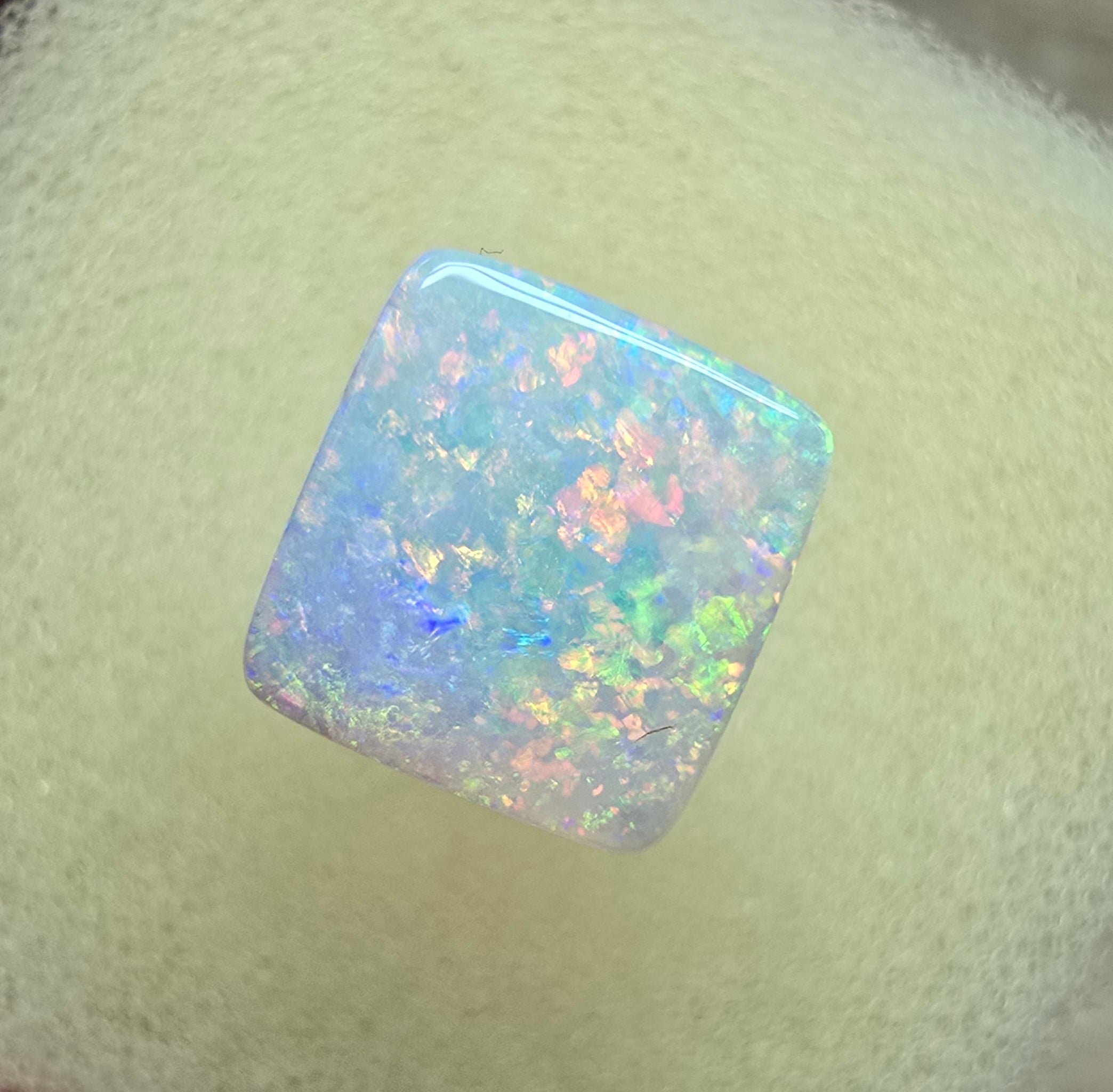 A912 - Brilliant cushion cut gem white opal
