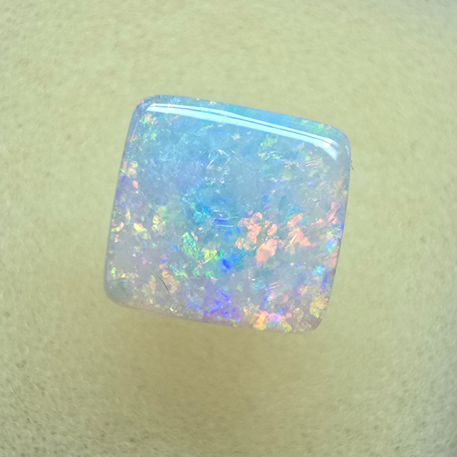 A912 - Brilliant cushion cut gem white opal