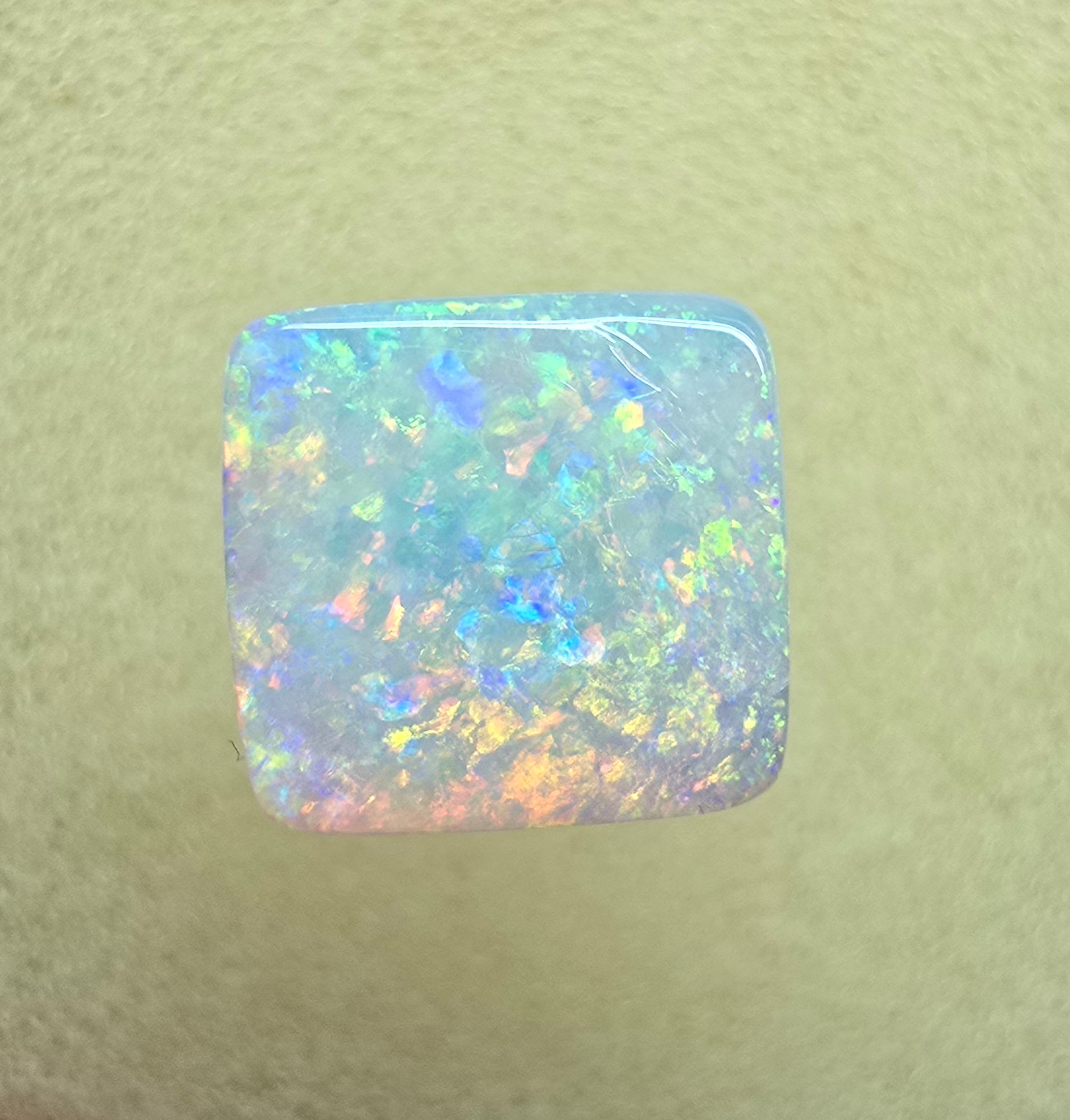 A912 - Brilliant cushion cut gem white opal