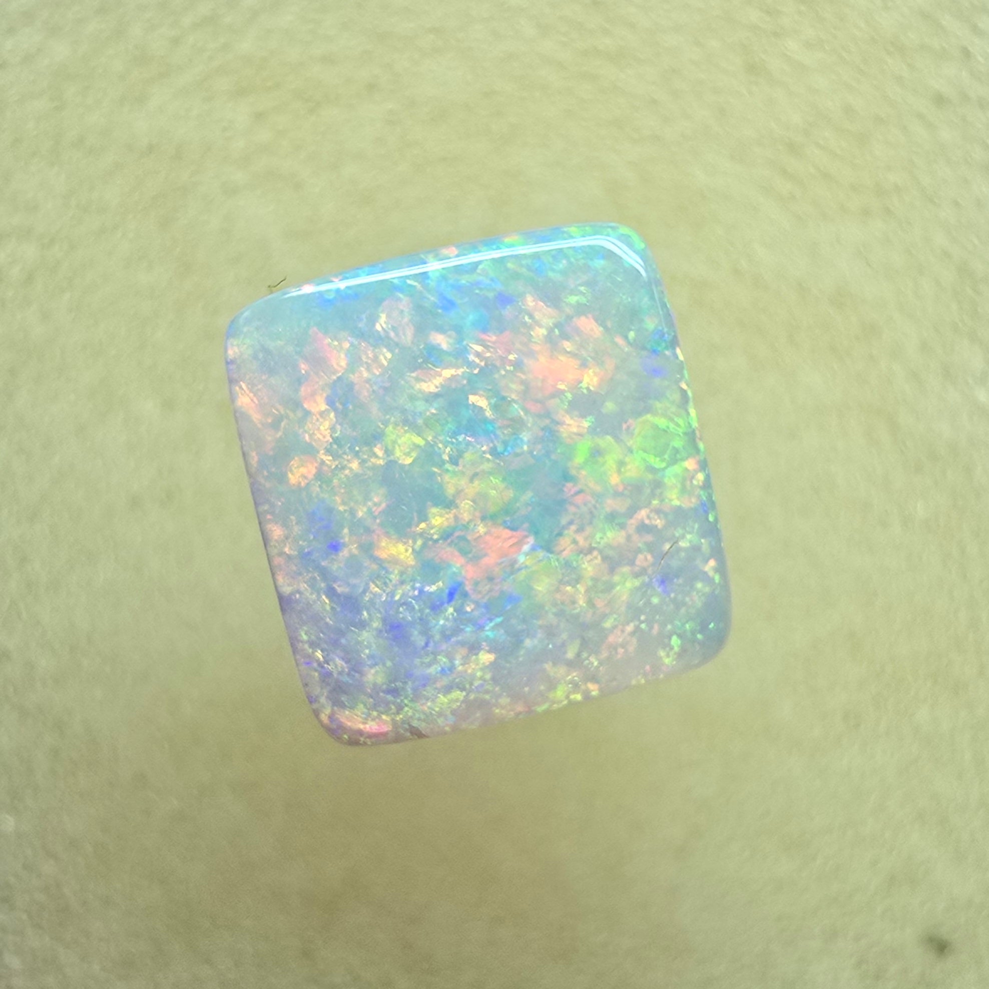 A912 - Brilliant cushion cut gem white opal