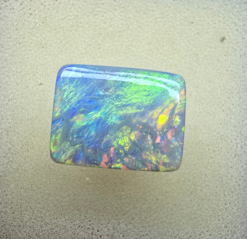 A940 - Stunning broad face cushion cut dark opal.