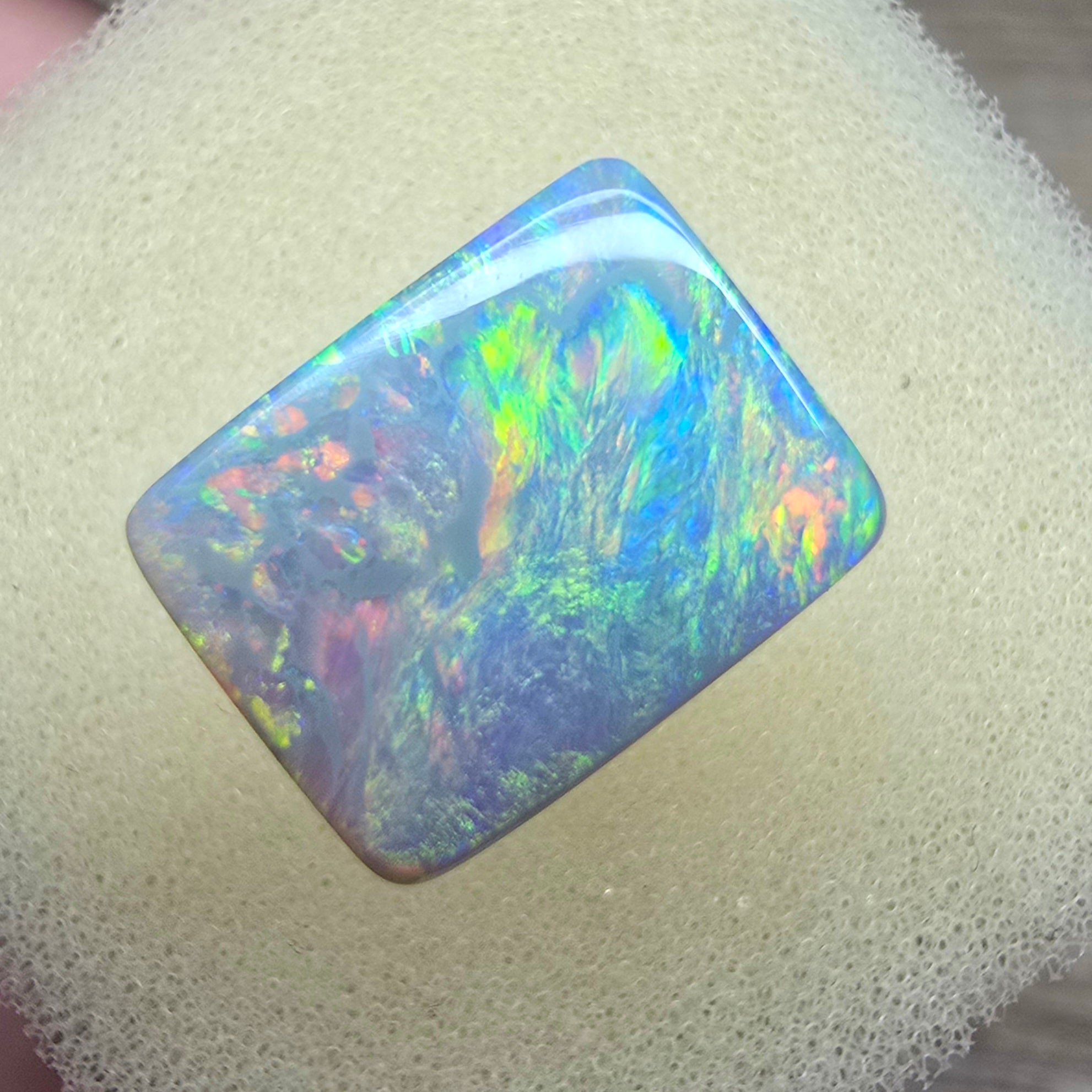 A940 - Stunning broad face cushion cut dark opal.