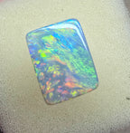 A940 - Stunning broad face cushion cut dark opal.