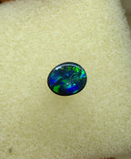 A945 - Bright black opal round cut