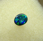 A945 - Bright black opal round cut