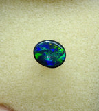 A945 - Bright black opal round cut