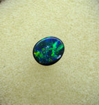 A945 - Bright black opal round cut