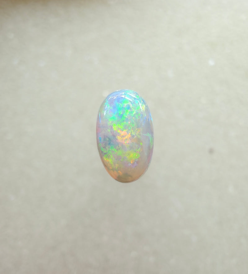 A963 - Bright round cut crystal opal.