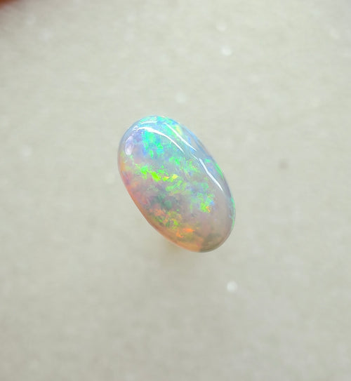 A963 - Bright round cut crystal opal.