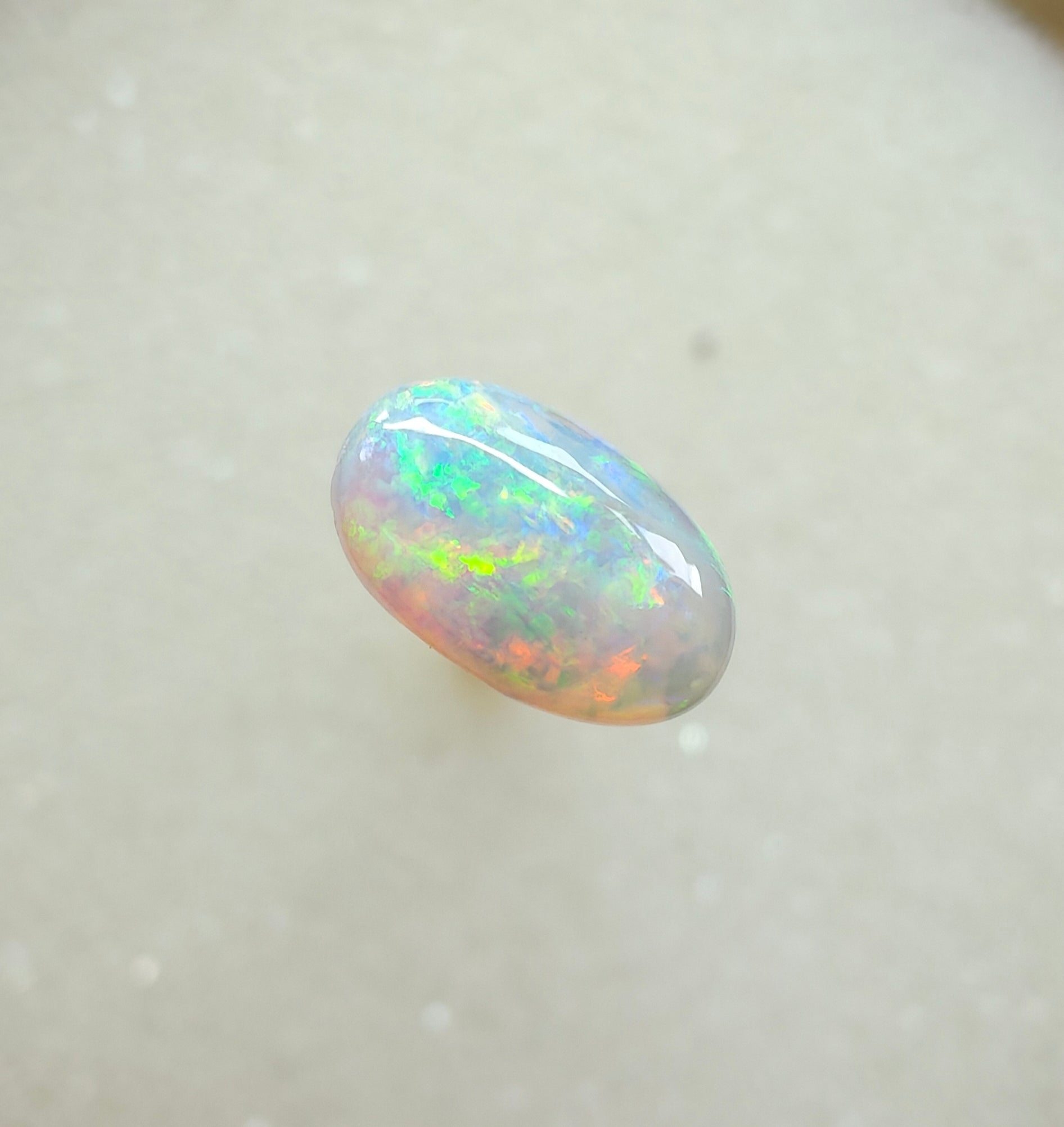 A963 - Bright round cut crystal opal.