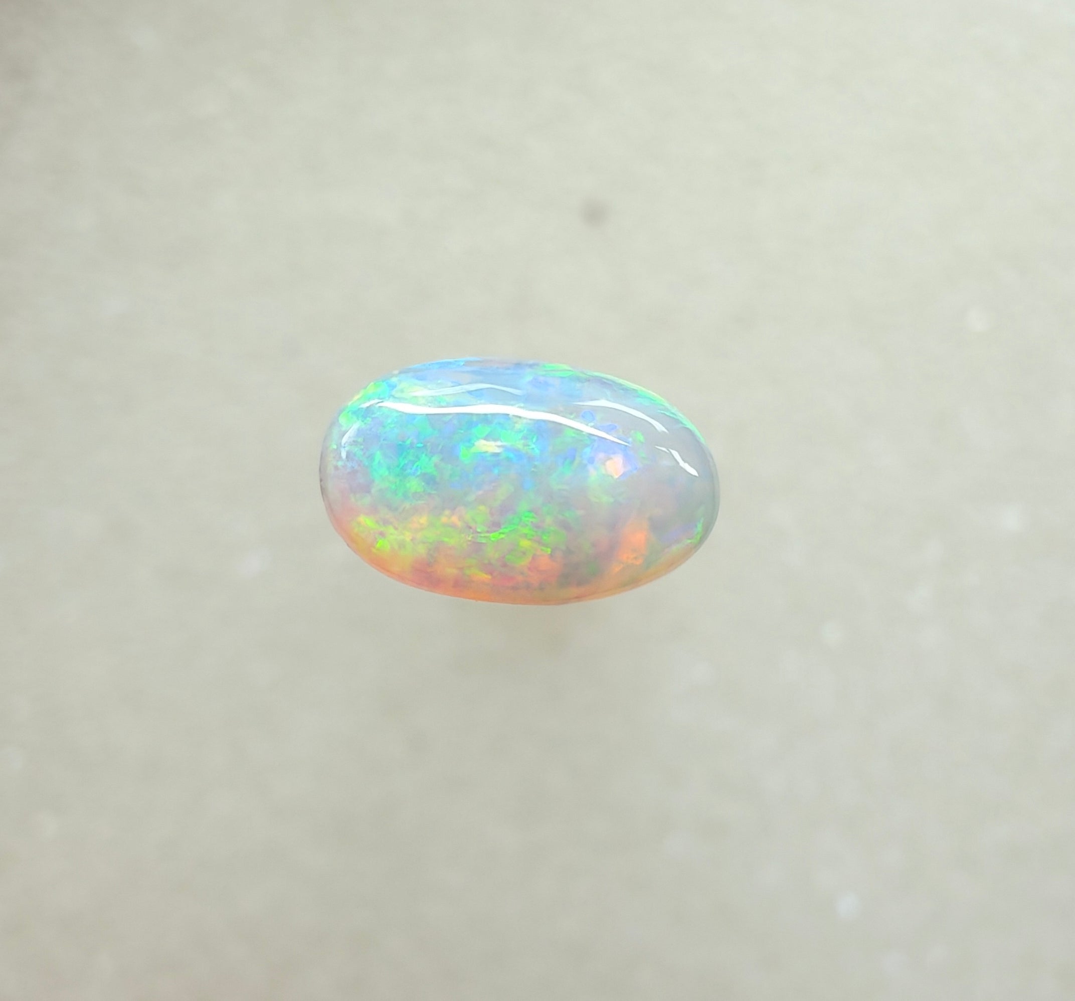 A963 - Bright round cut crystal opal.