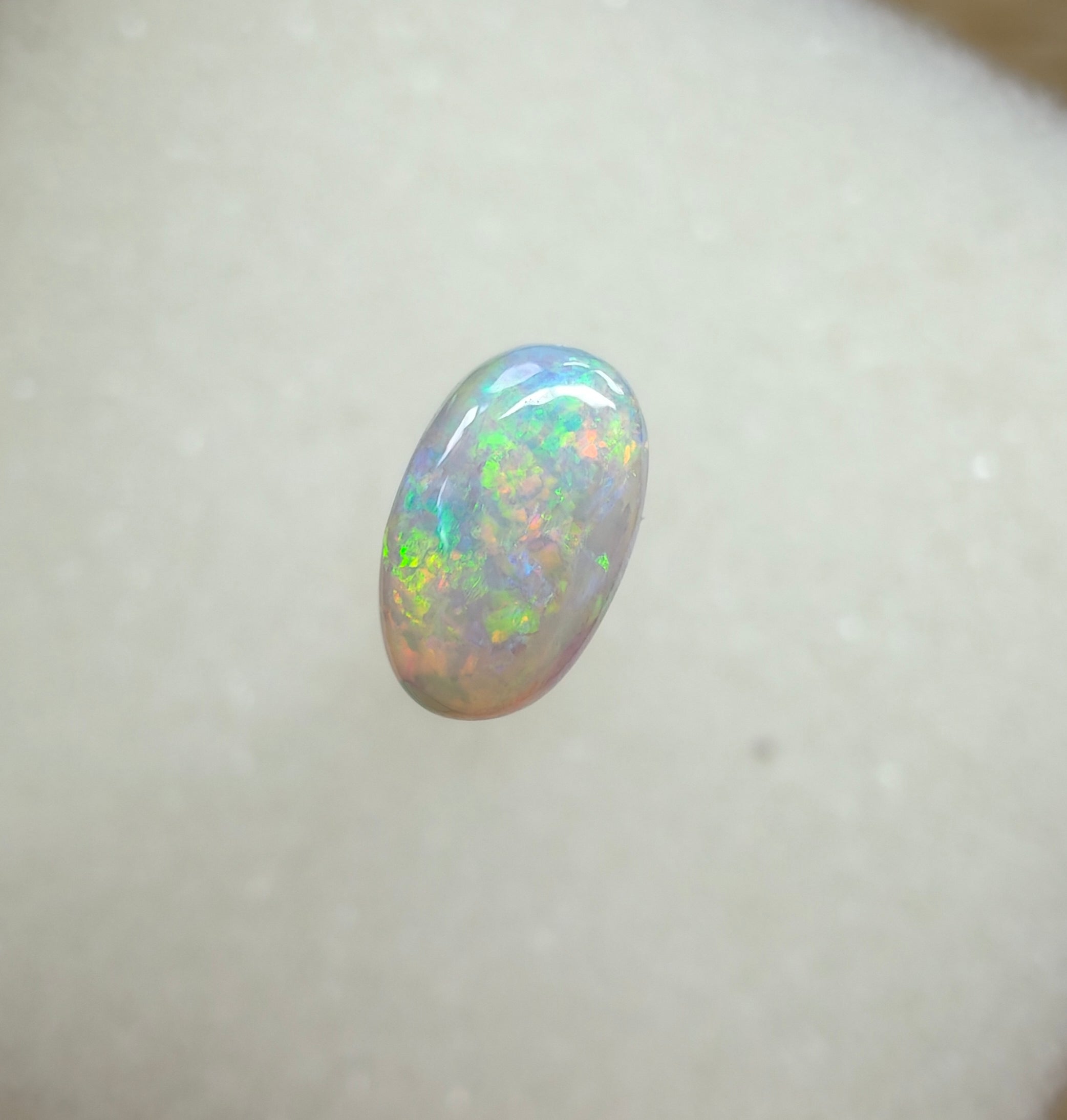 A963 - Bright round cut crystal opal.