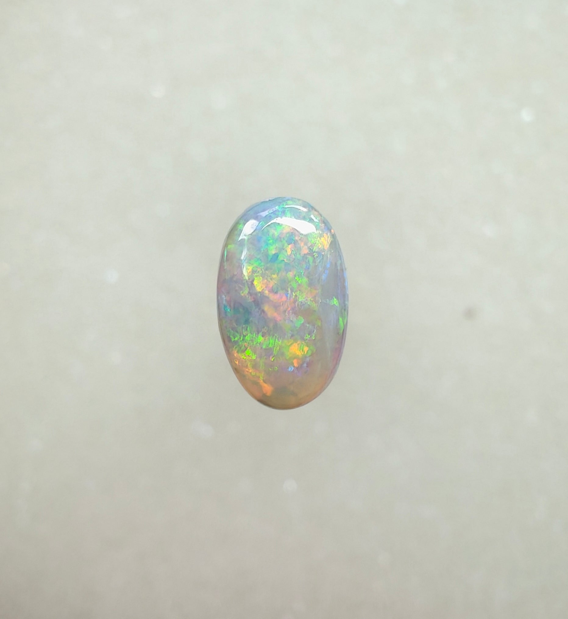 A963 - Bright round cut crystal opal.