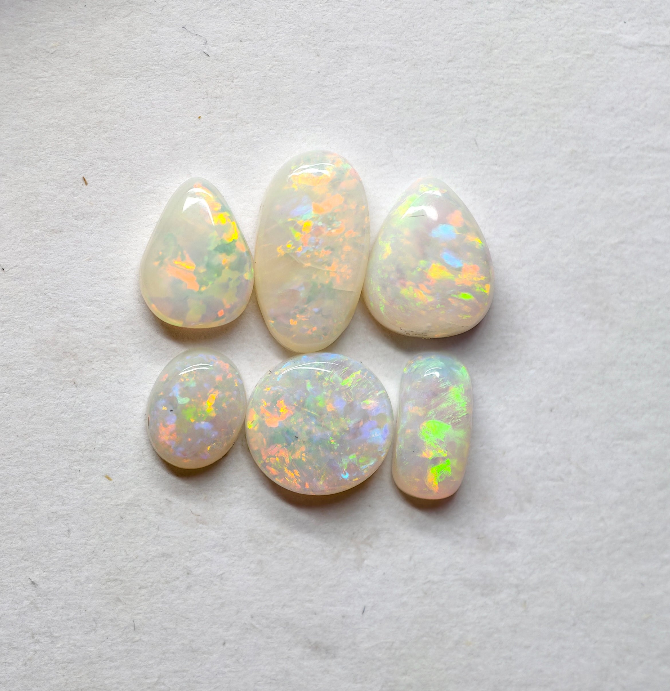 A970 - Jewellers parcel red flash white opal