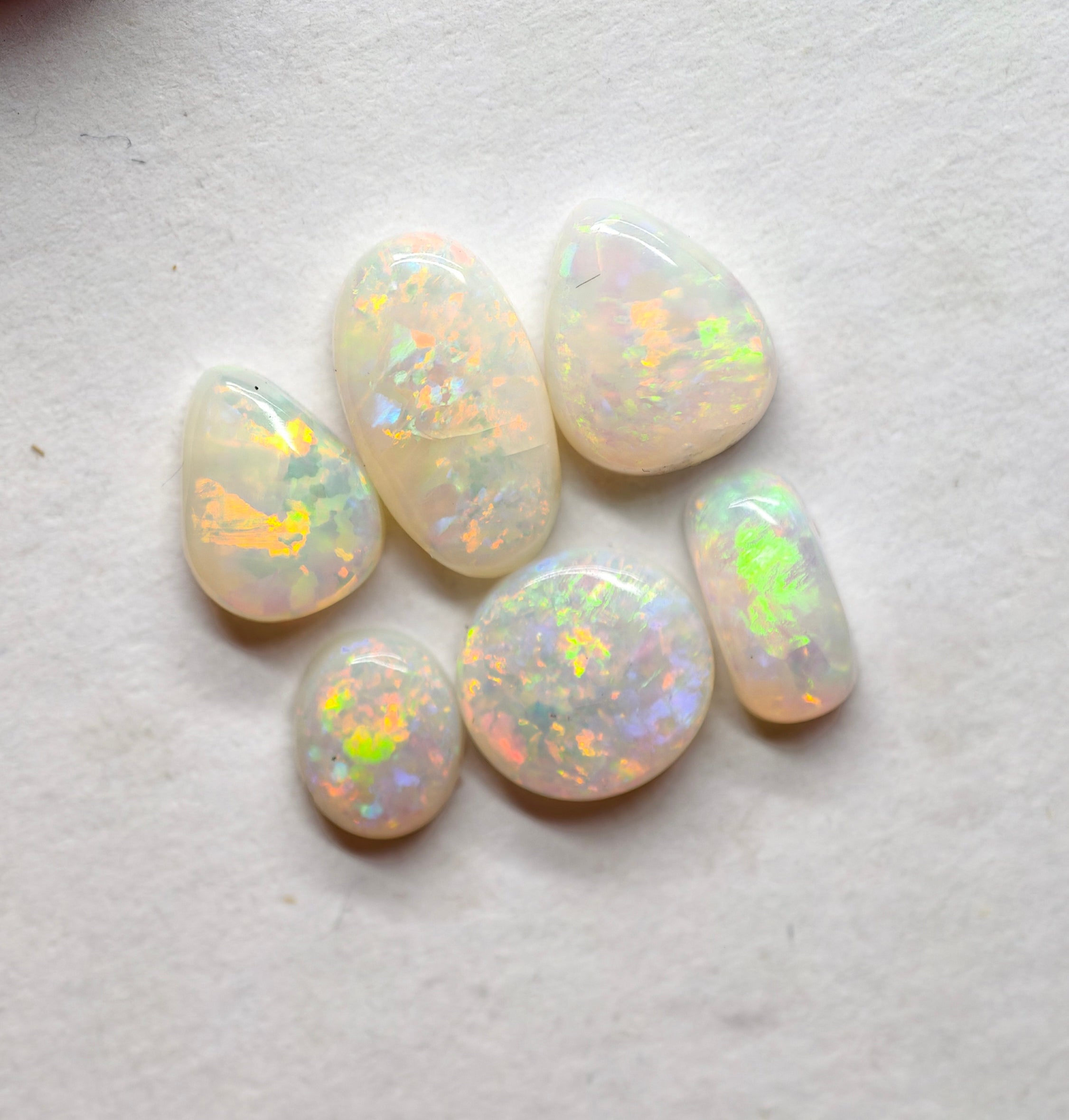 A970 - Jewellers parcel red flash white opal