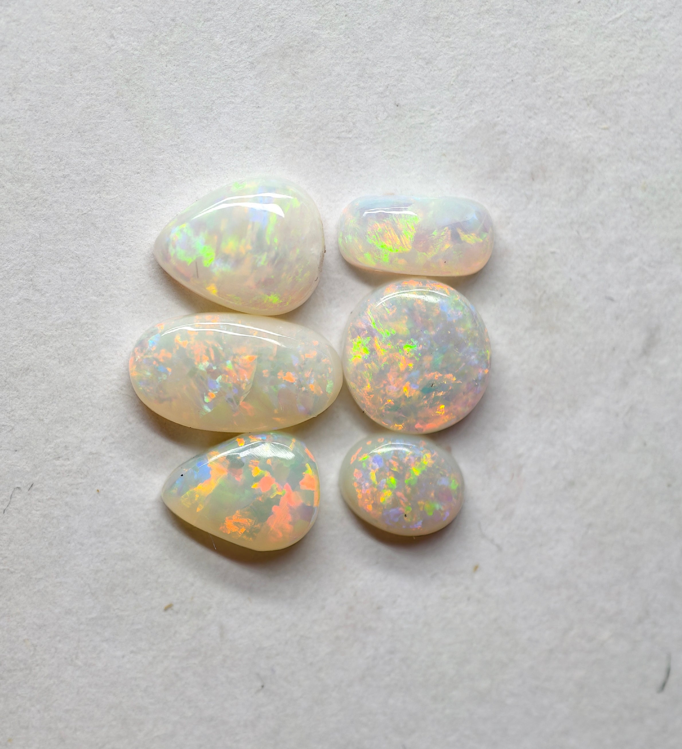 A970 - Jewellers parcel red flash white opal