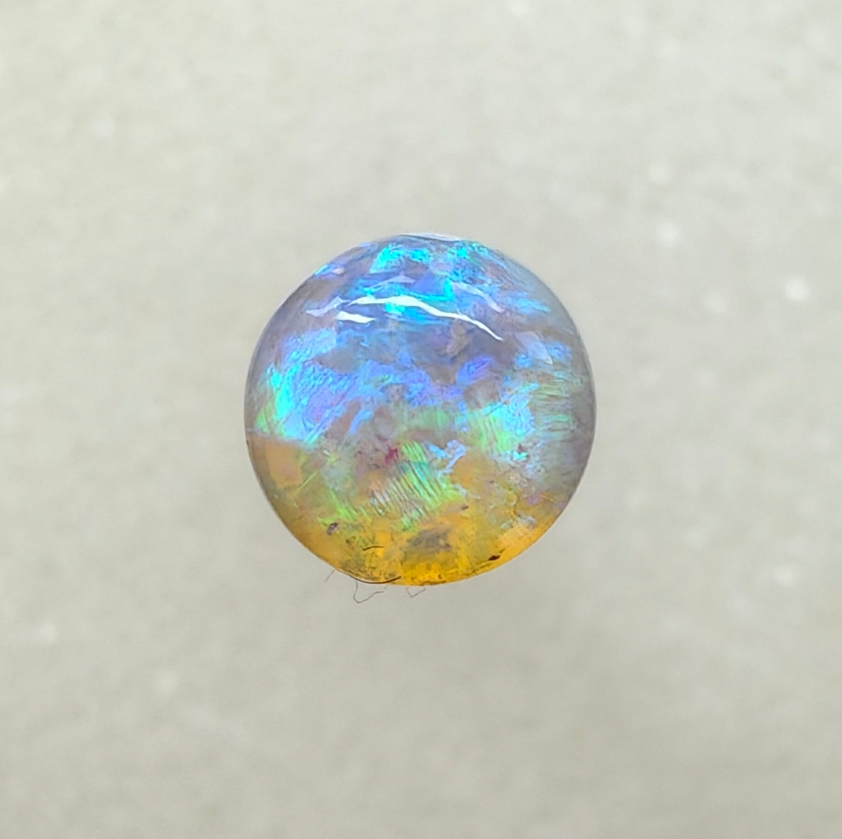 A982 - Round cut blue green crystal opal