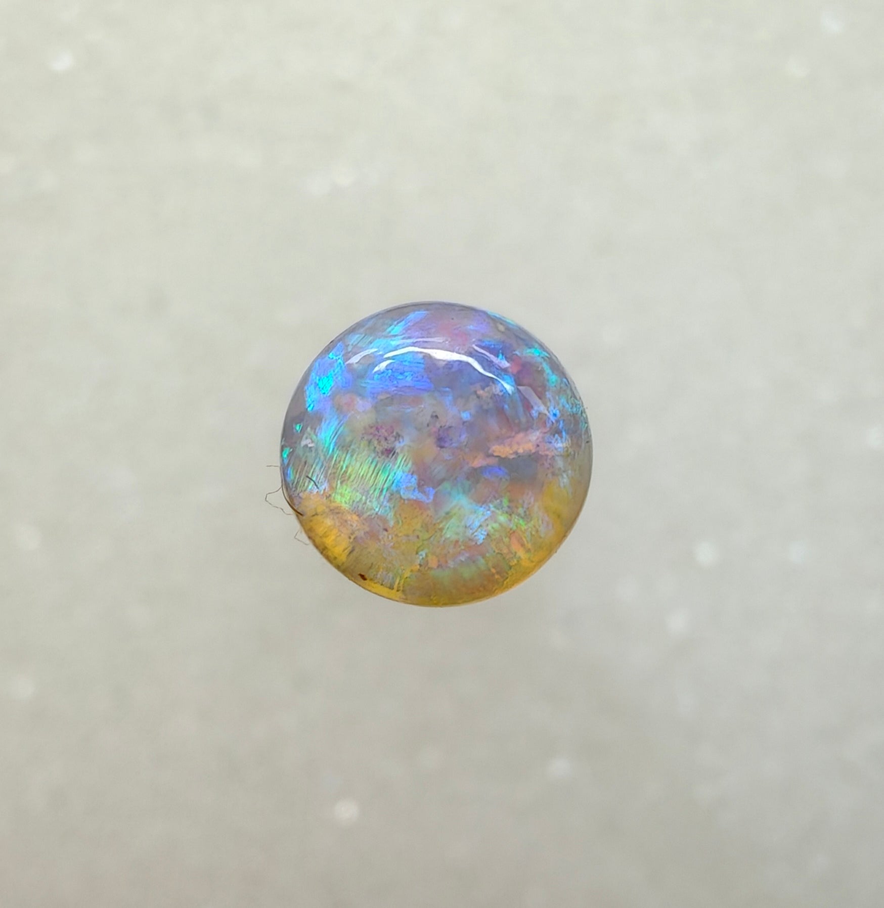 A982 - Round cut blue green crystal opal