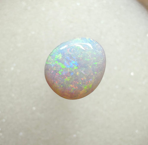 A996 - Large round cut pearl white opal.