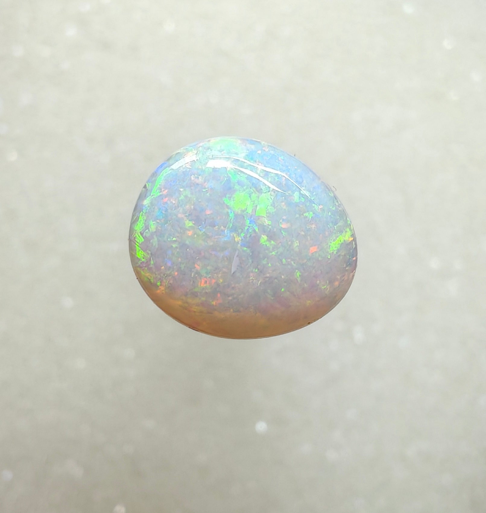 A996 - Large round cut pearl white opal.