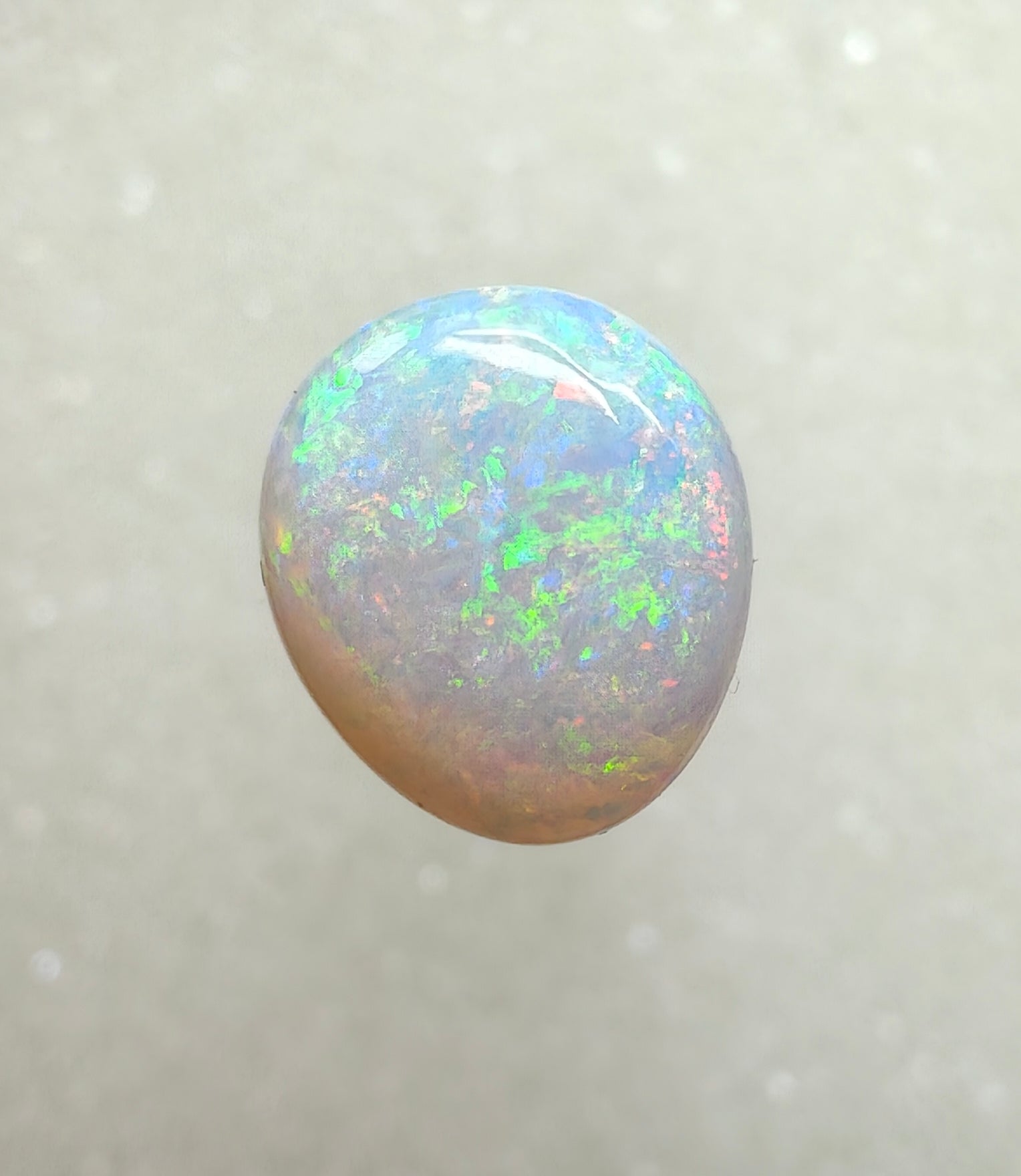 A996 - Large round cut pearl white opal.