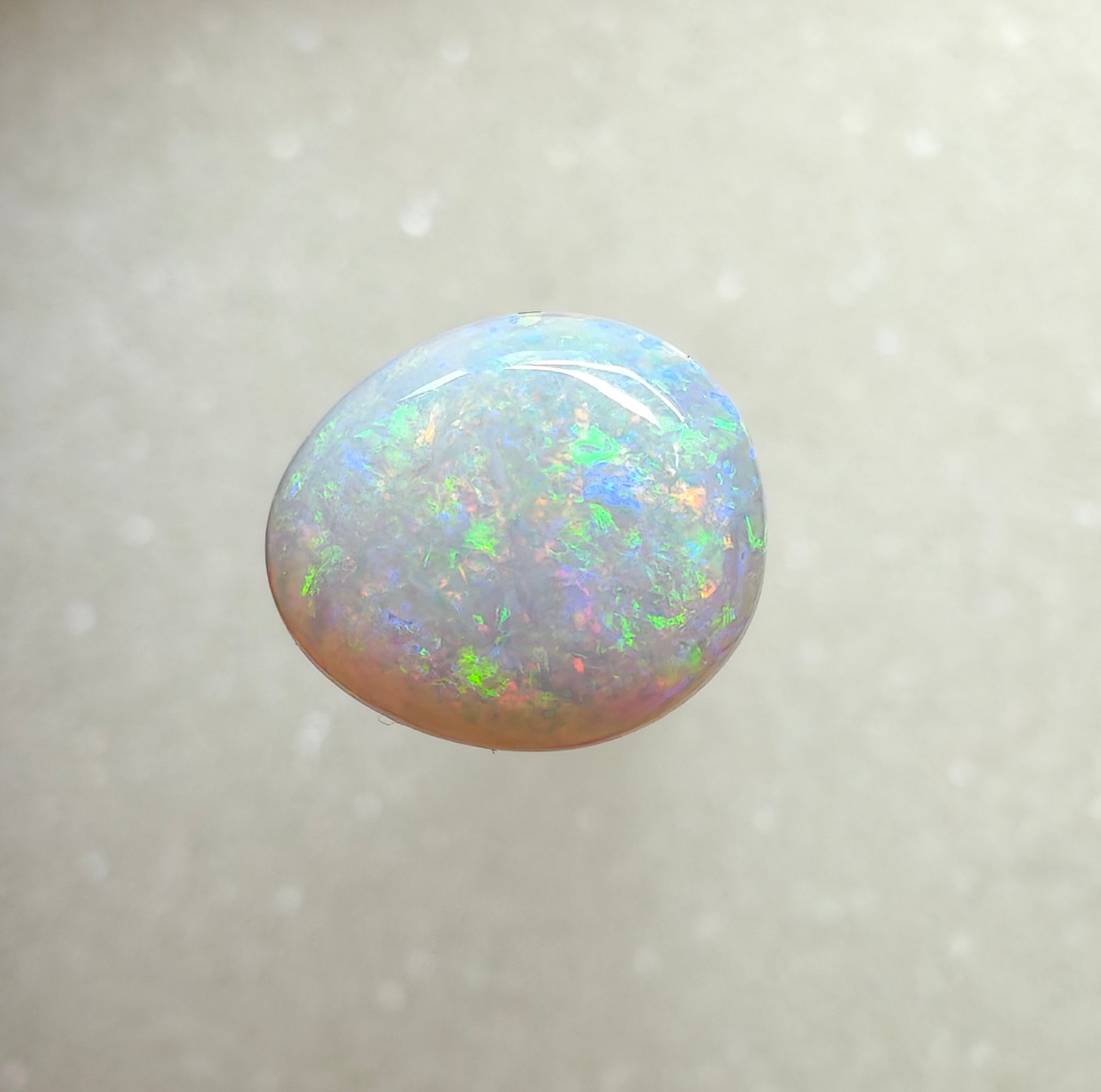 A996 - Large round cut pearl white opal.