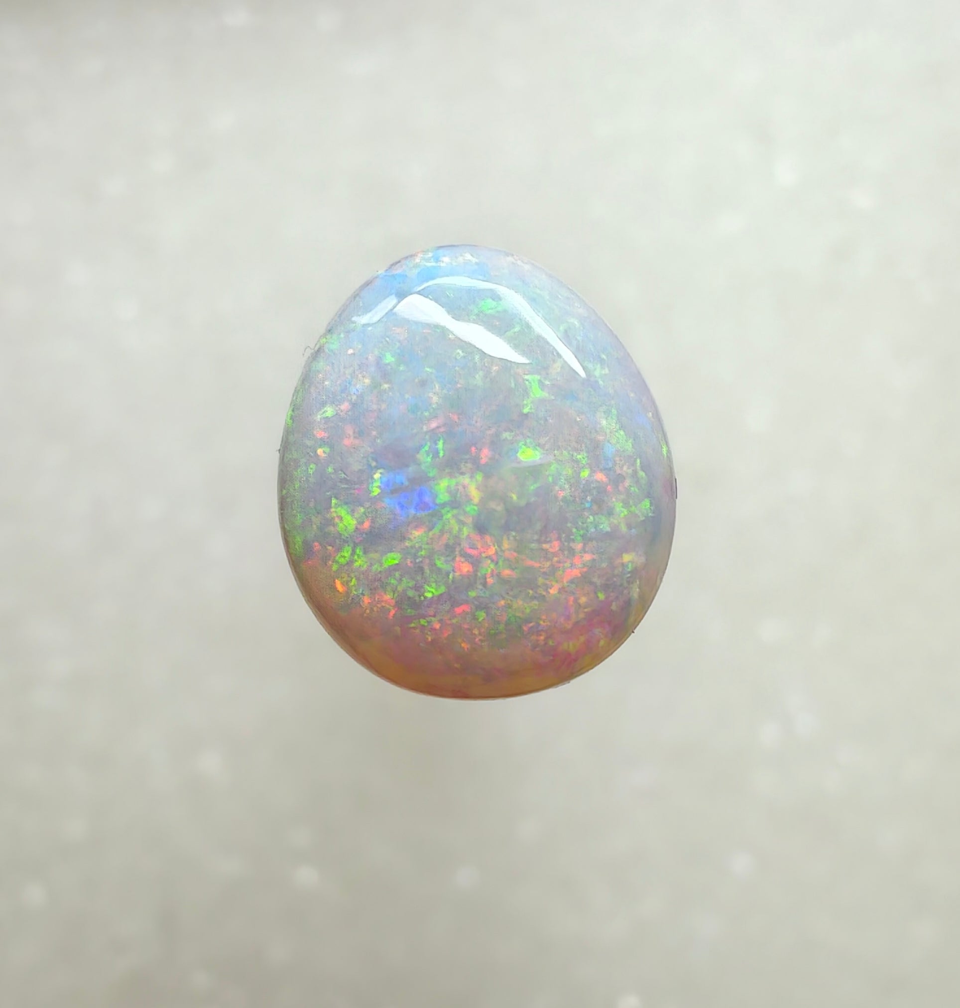 A996 - Large round cut pearl white opal.