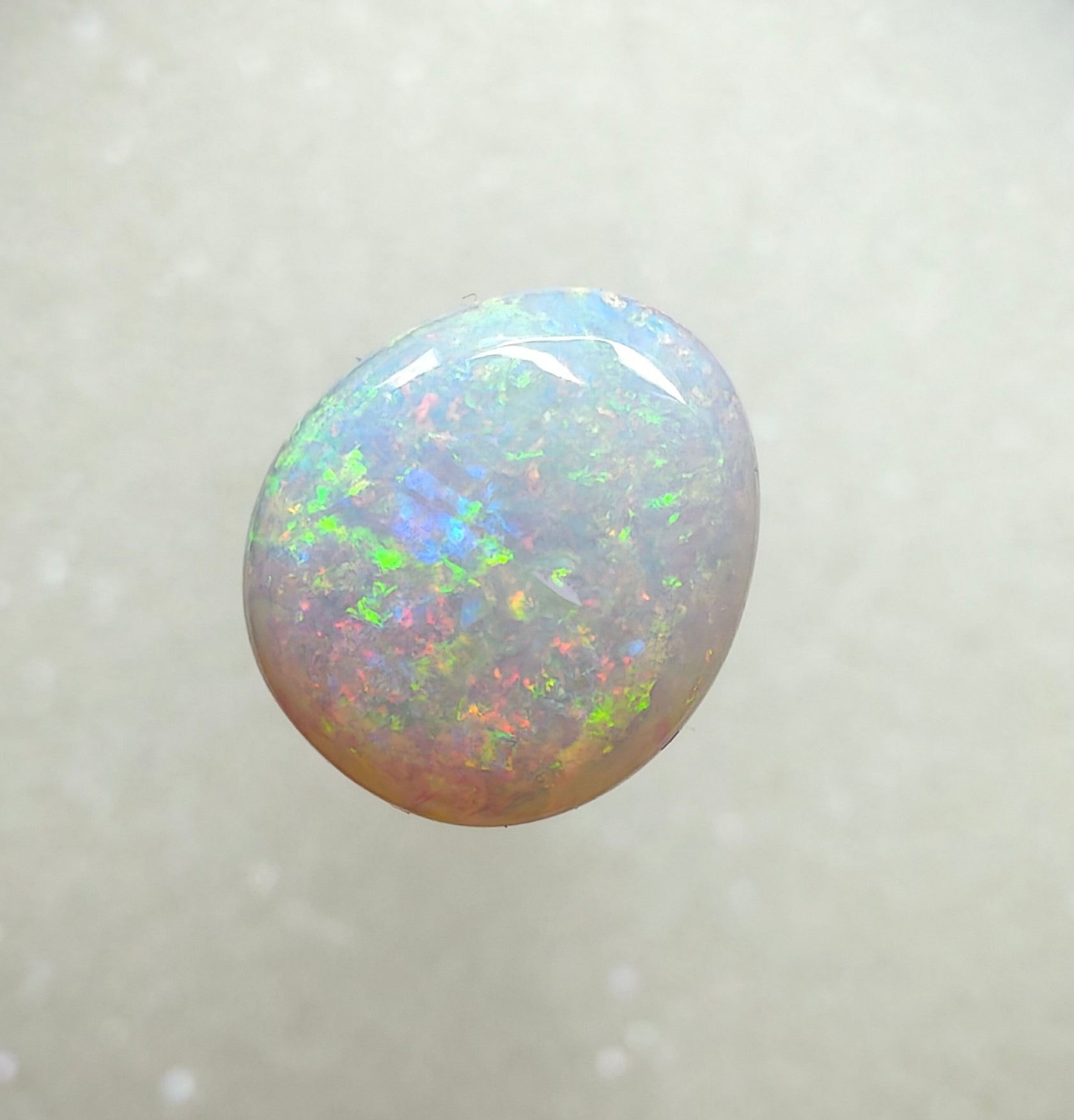 A996 - Large round cut pearl white opal.