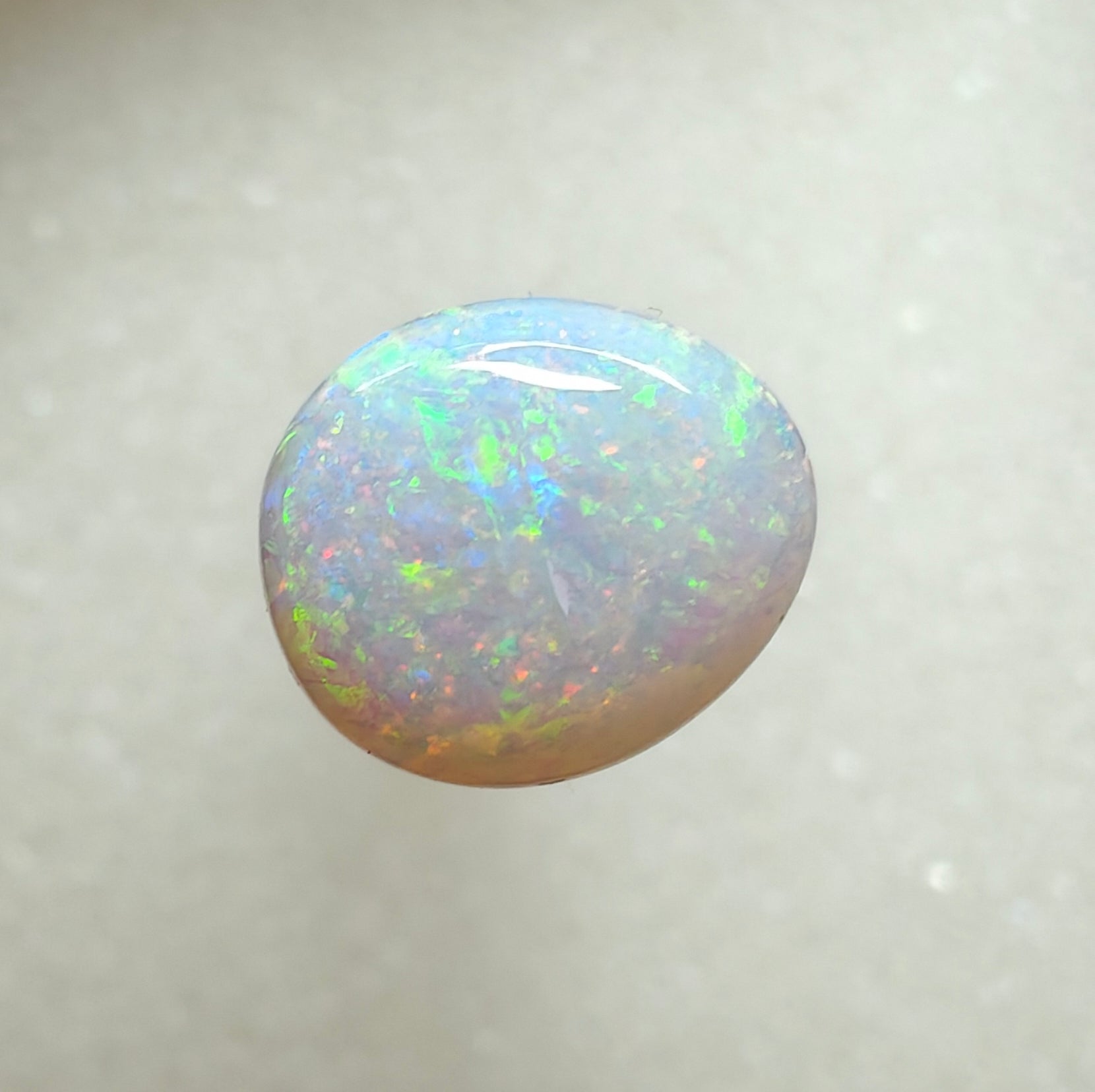 A996 - Large round cut pearl white opal.