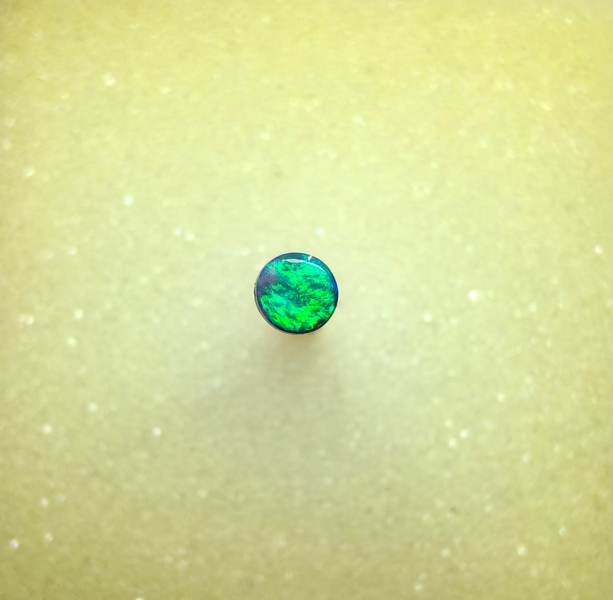 A1068 - Bright round cut black opal