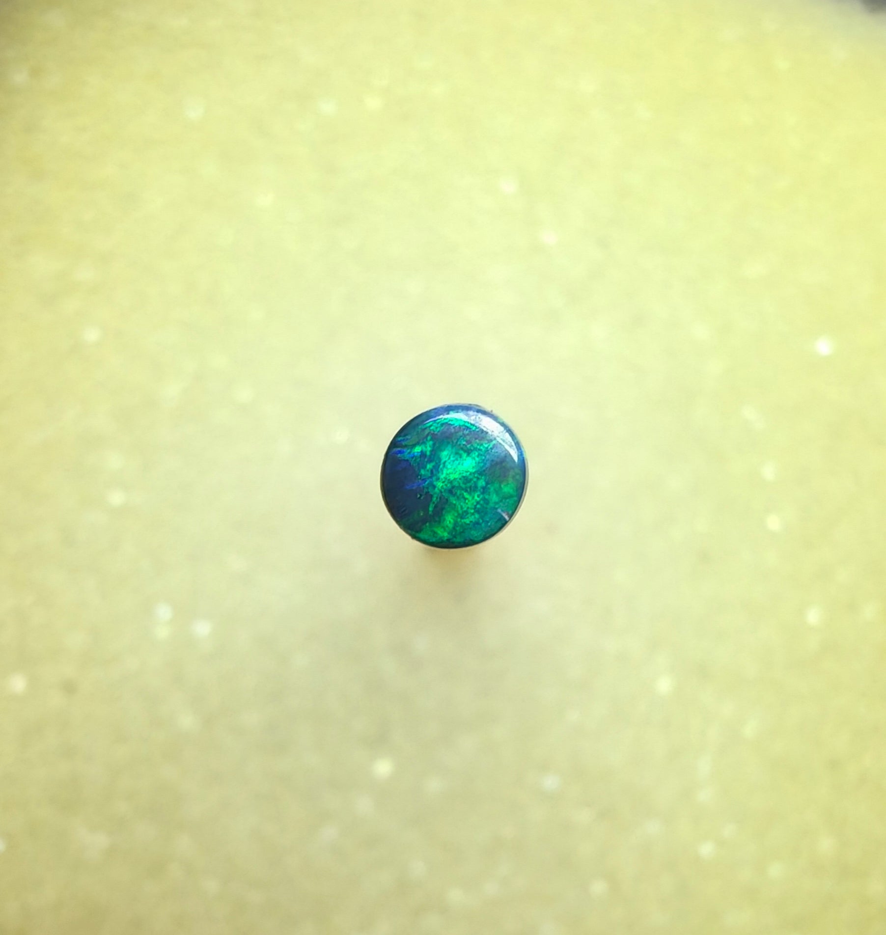 A1068 - Bright round cut black opal