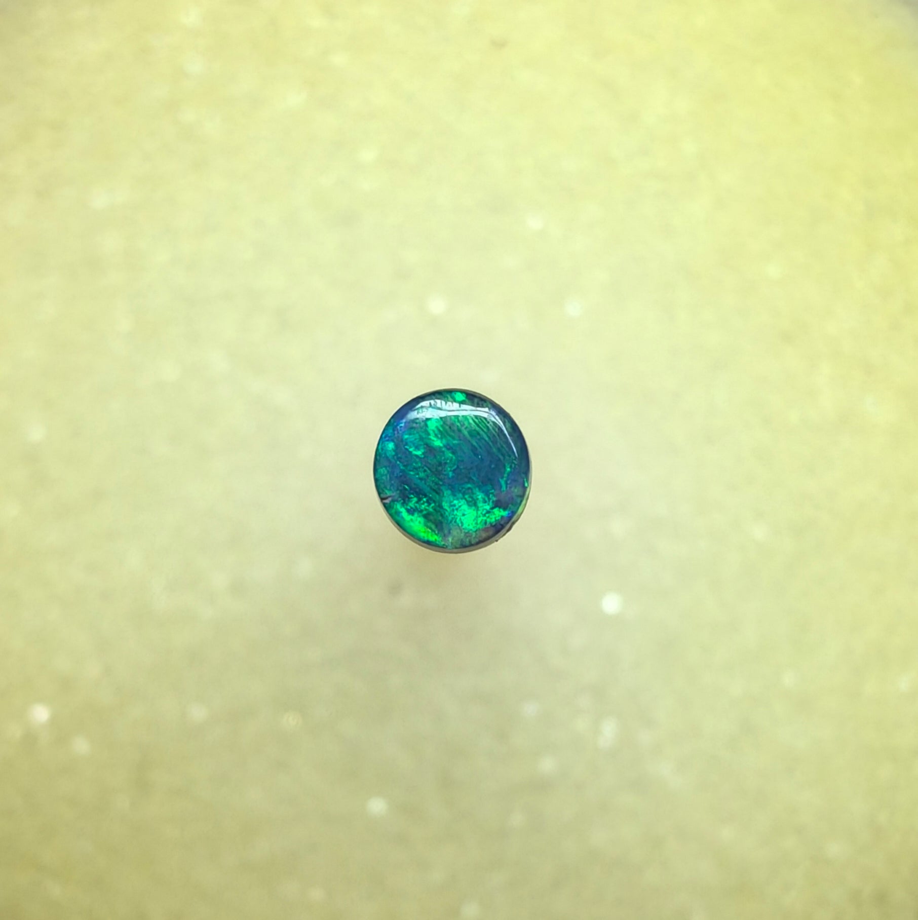 A1068 - Bright round cut black opal