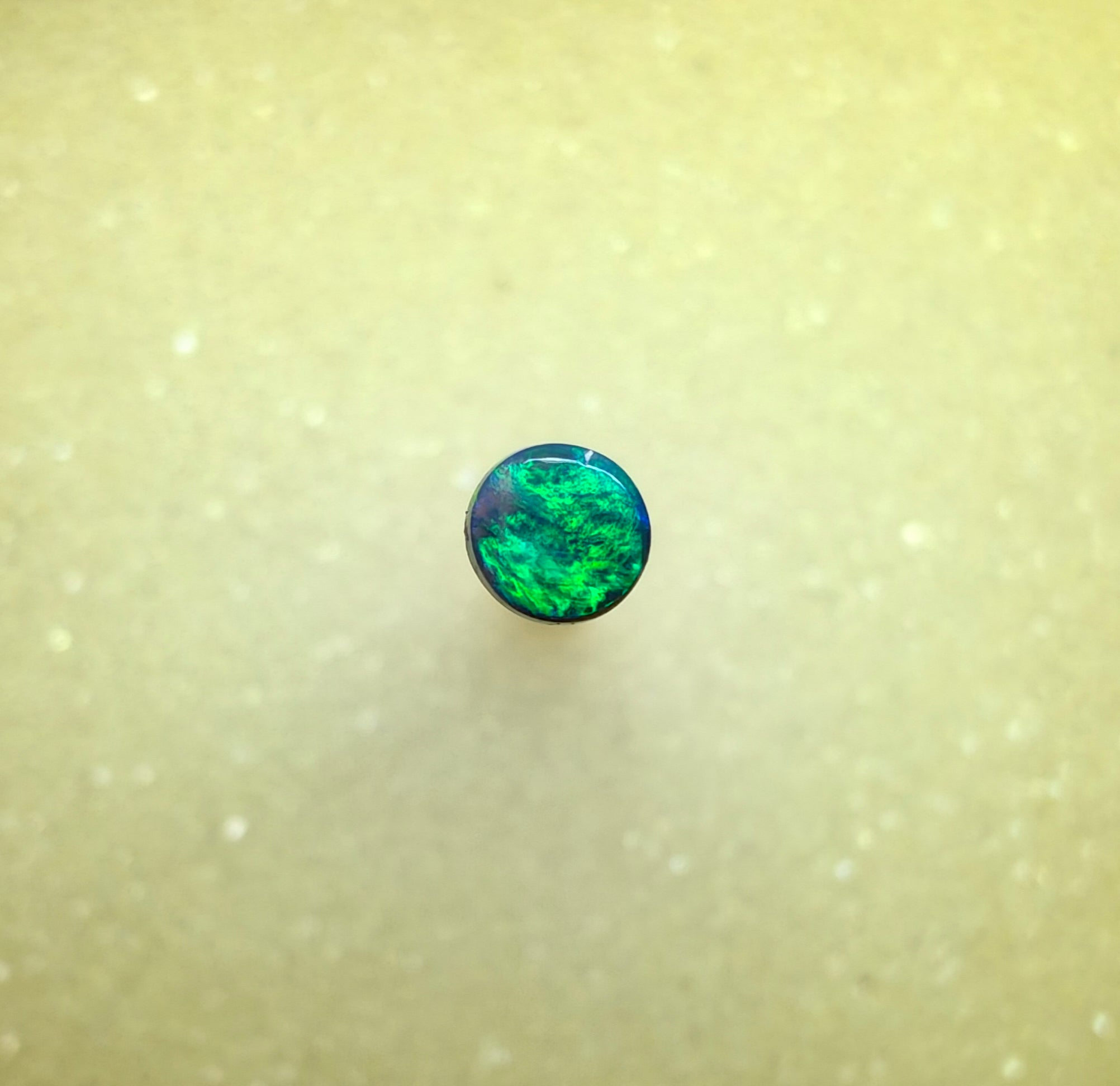 A1068 - Bright round cut black opal
