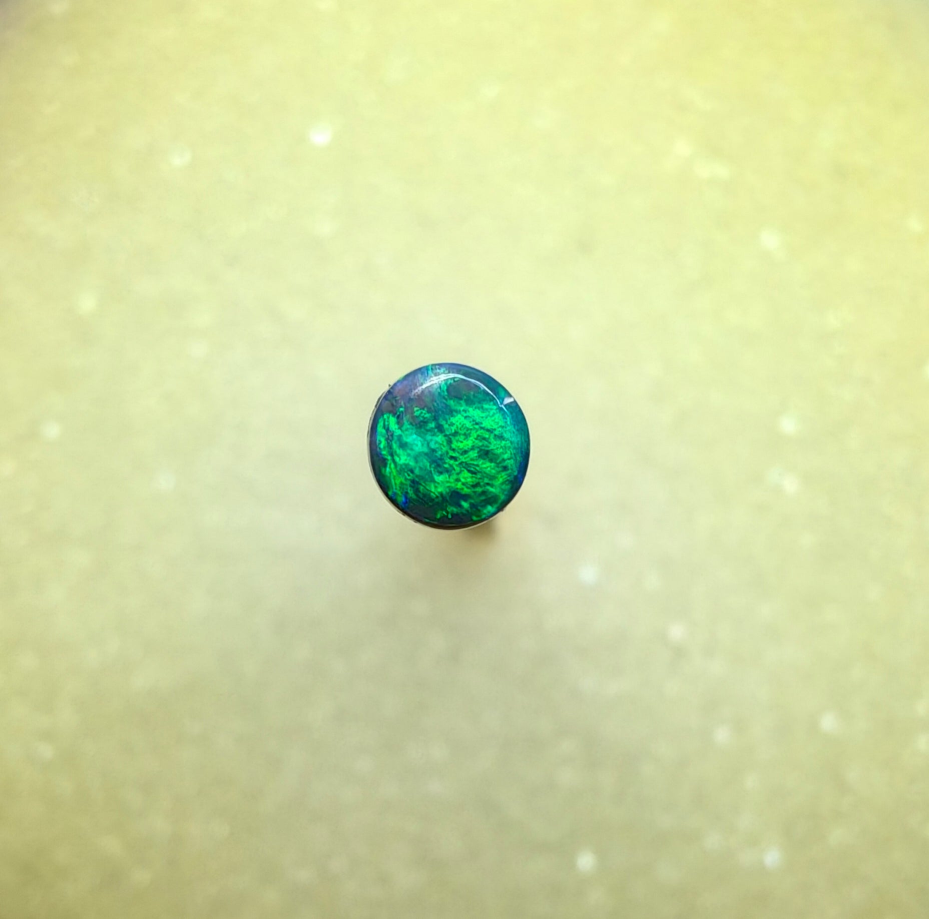 A1068 - Bright round cut black opal