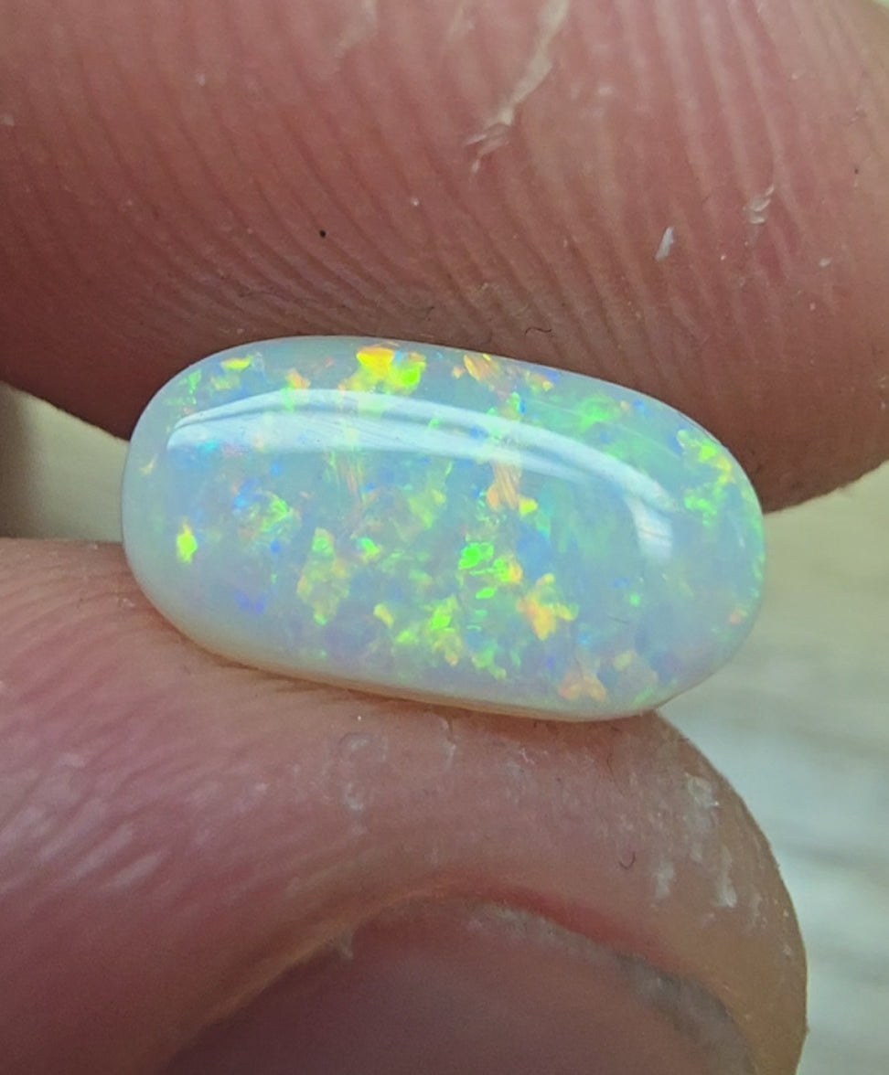 A911 - Oval cut bright red fire white opal