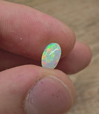 A963 - Bright round cut crystal opal.