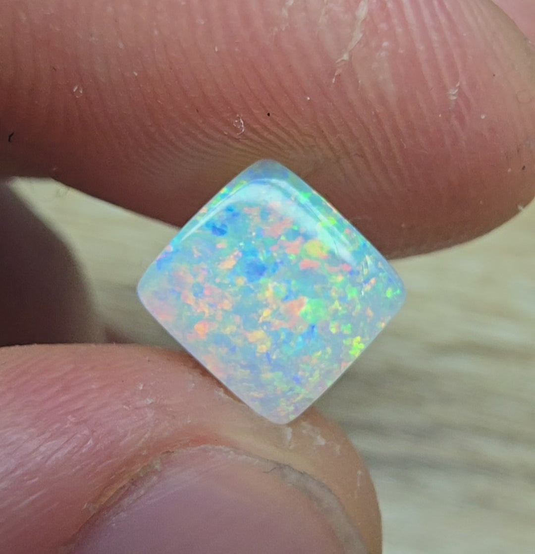 A912 - Brilliant cushion cut gem white opal