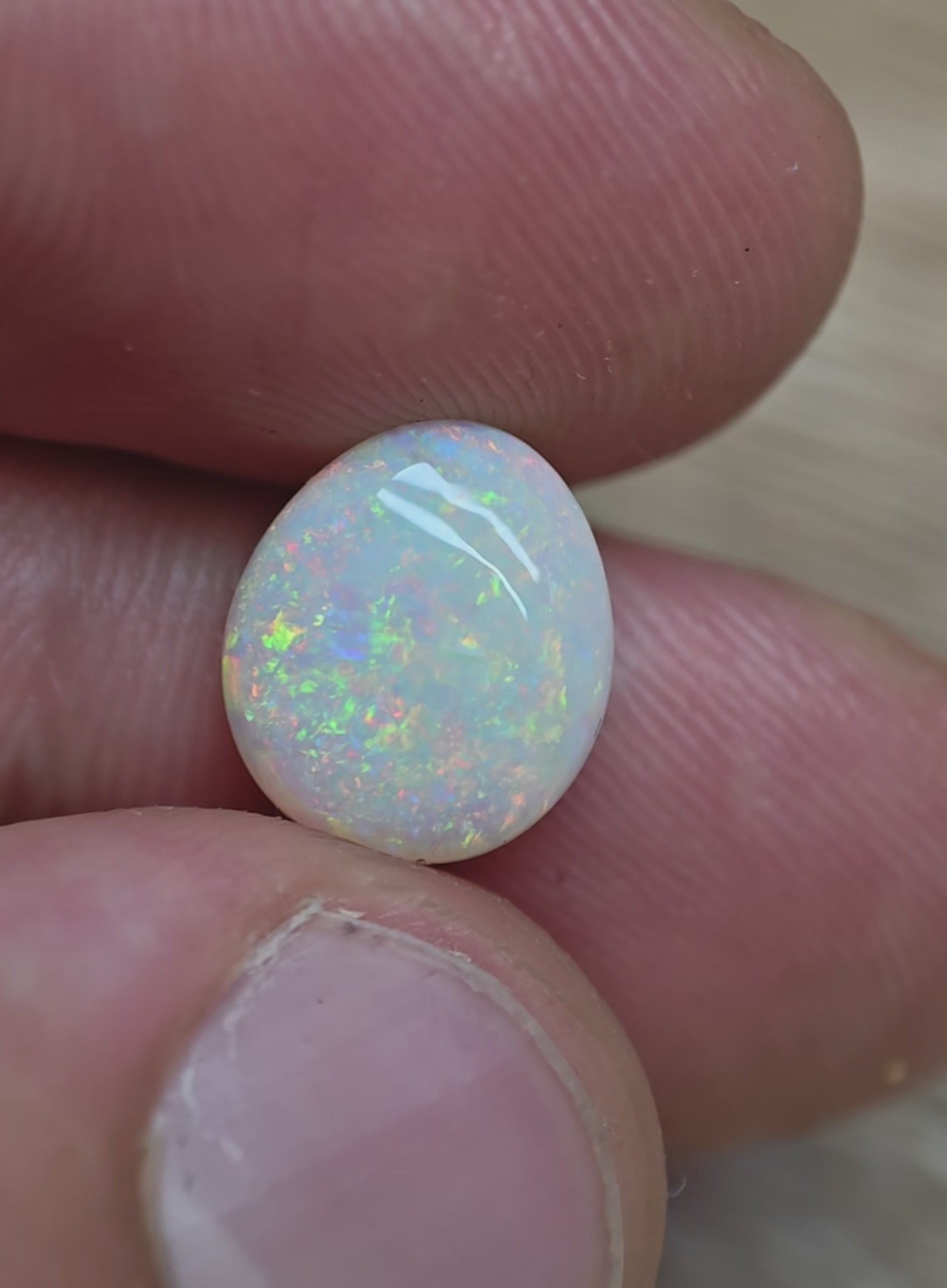 A996 - Large round cut pearl white opal.