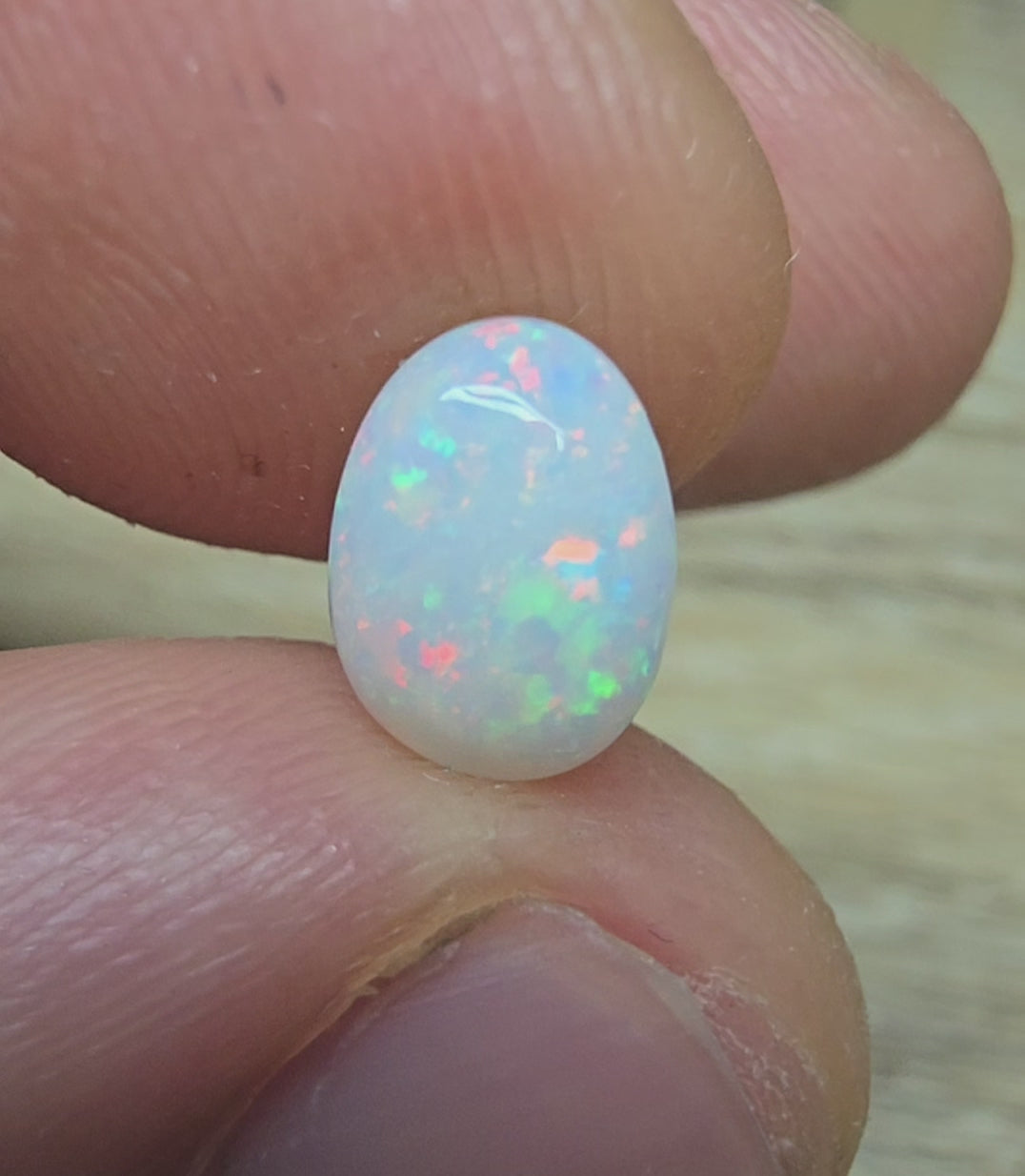 A889 - Pearl white round cut opal