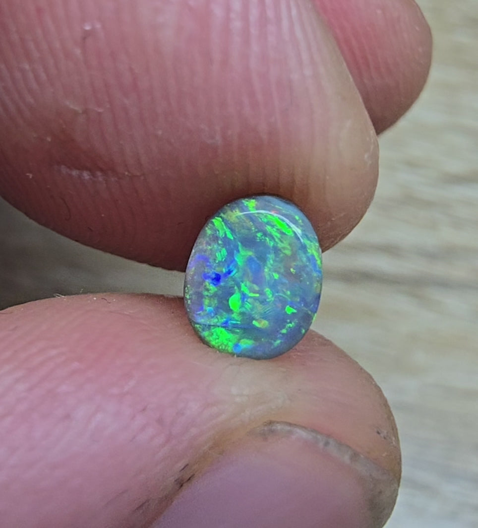 A841 - Bright oval cut black opal