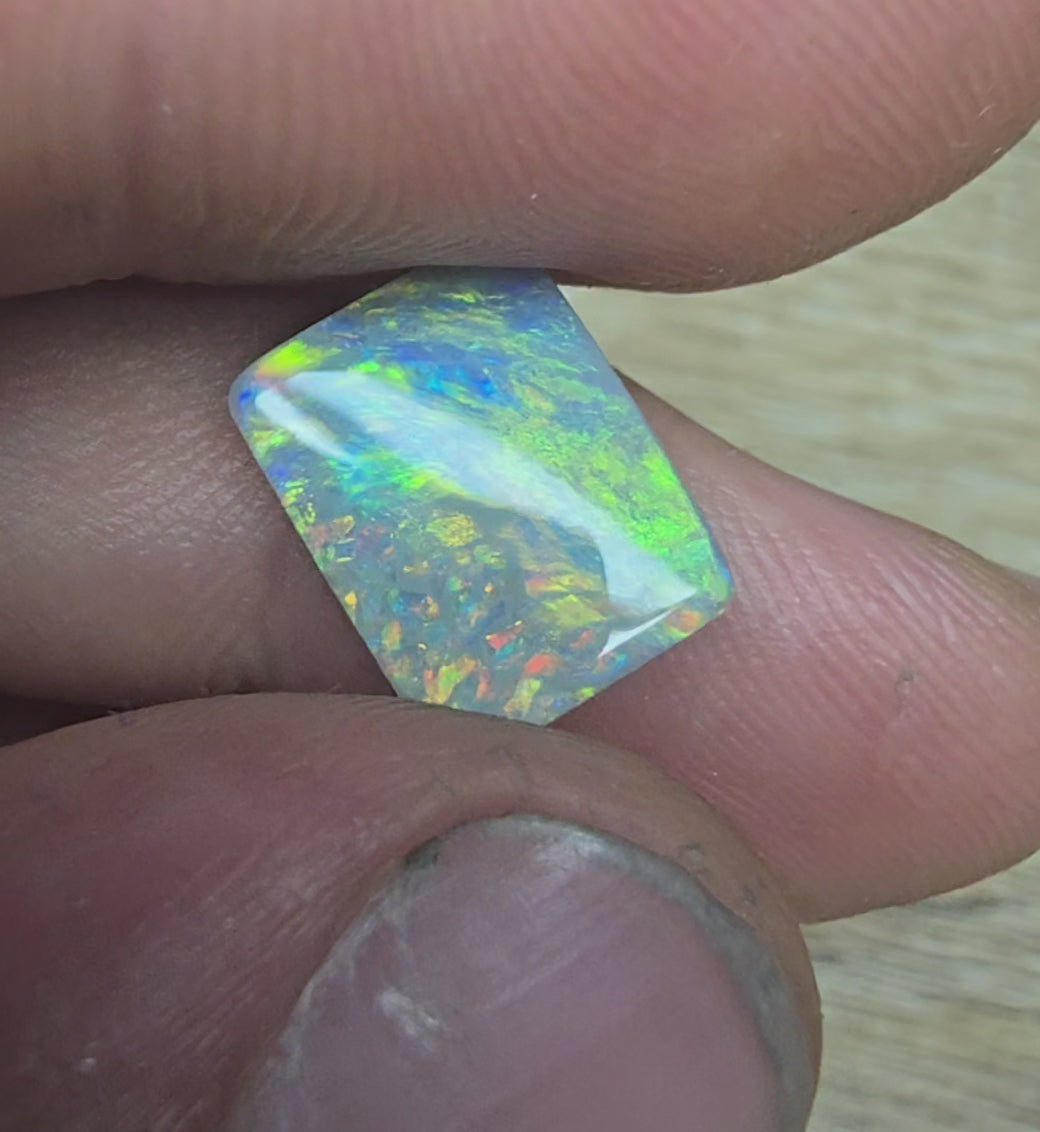 A940 - Stunning broad face cushion cut dark opal.