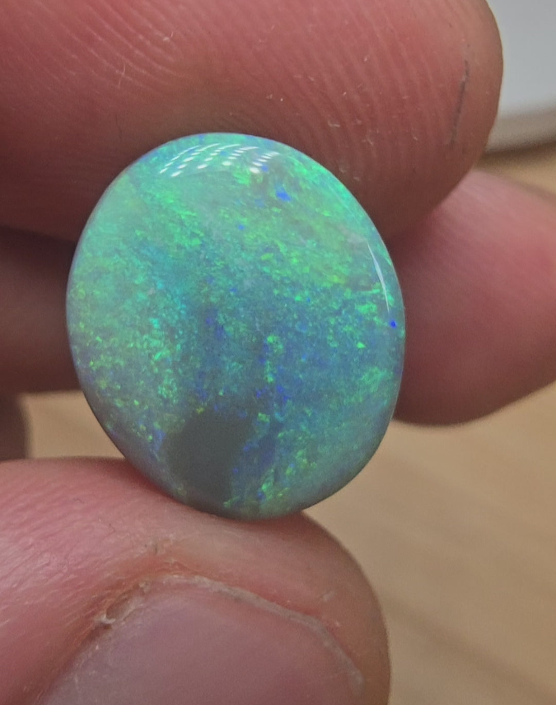A606 - Large broad faced dark opal
